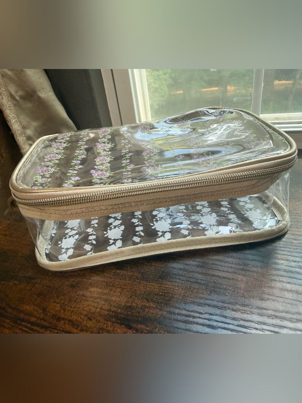 Tahari Clear Cosmetic Bag with Beige Trim and Purple Floral Pattern